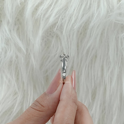 Lab Made Diamond Round Cut Solitaire Engagement Ring held by woman showing sleek band