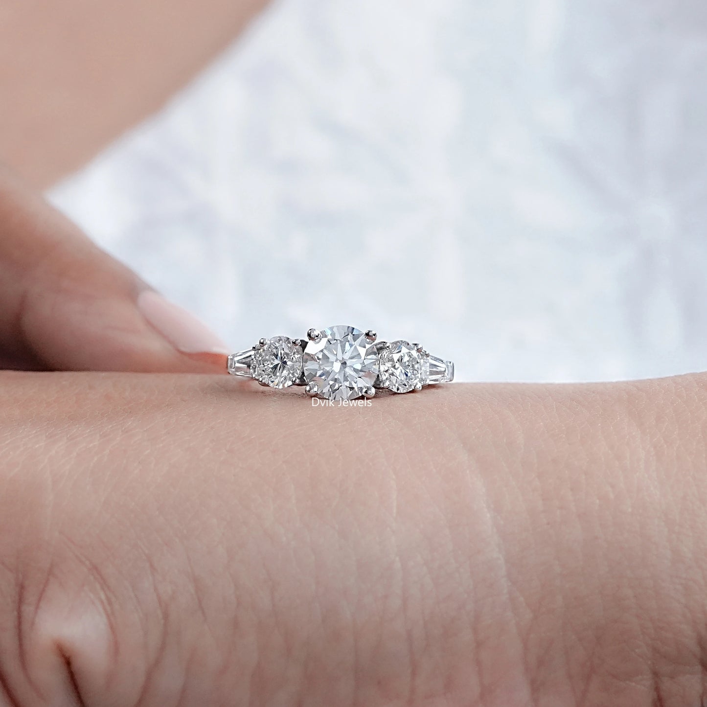 Five Stone Round And Tapered Baguette Diamond Ring