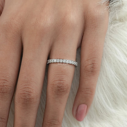 Slim pave half eternity band with gia lab grown diamond worn by women