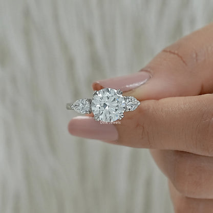 Round and pear diamond ring lab grown diamond three stone ring Finger view
