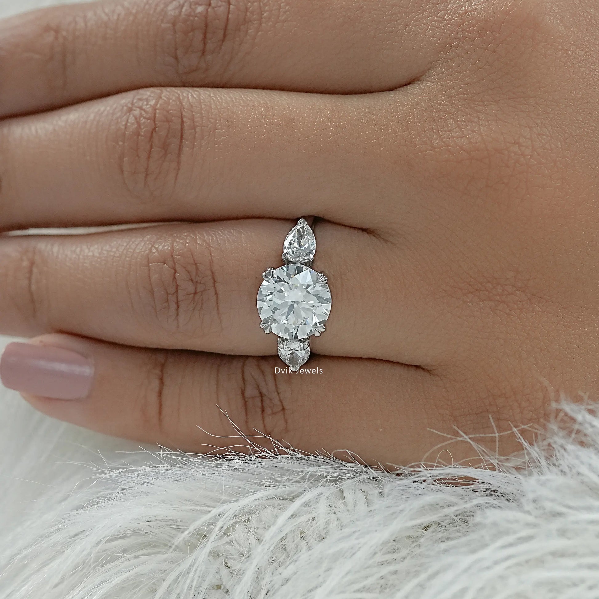 Round and pear engagement ring double prong engagement rings top view