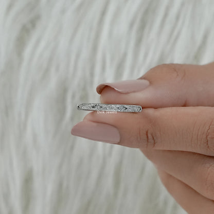 Women's wedding bands gold textured style held in hand close up