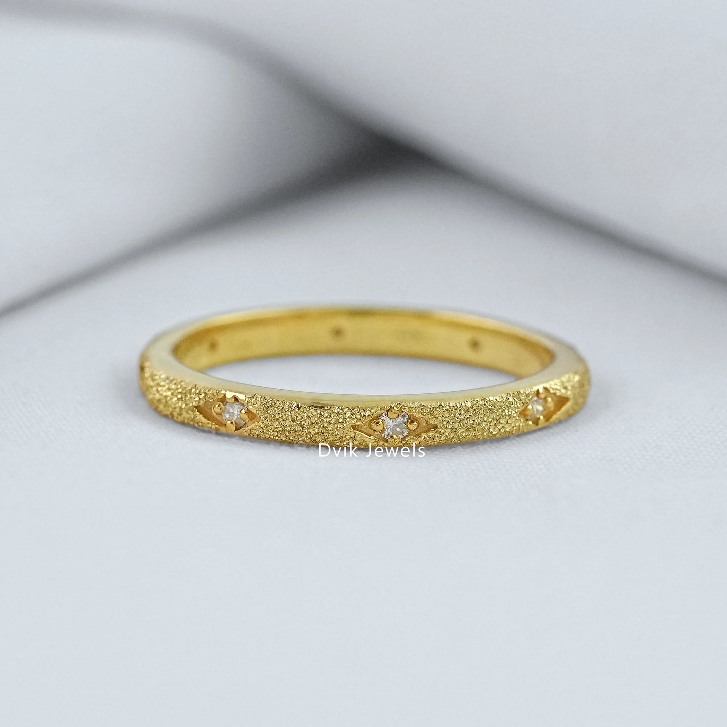 Textured wedding band silver with star setting diamonds on box