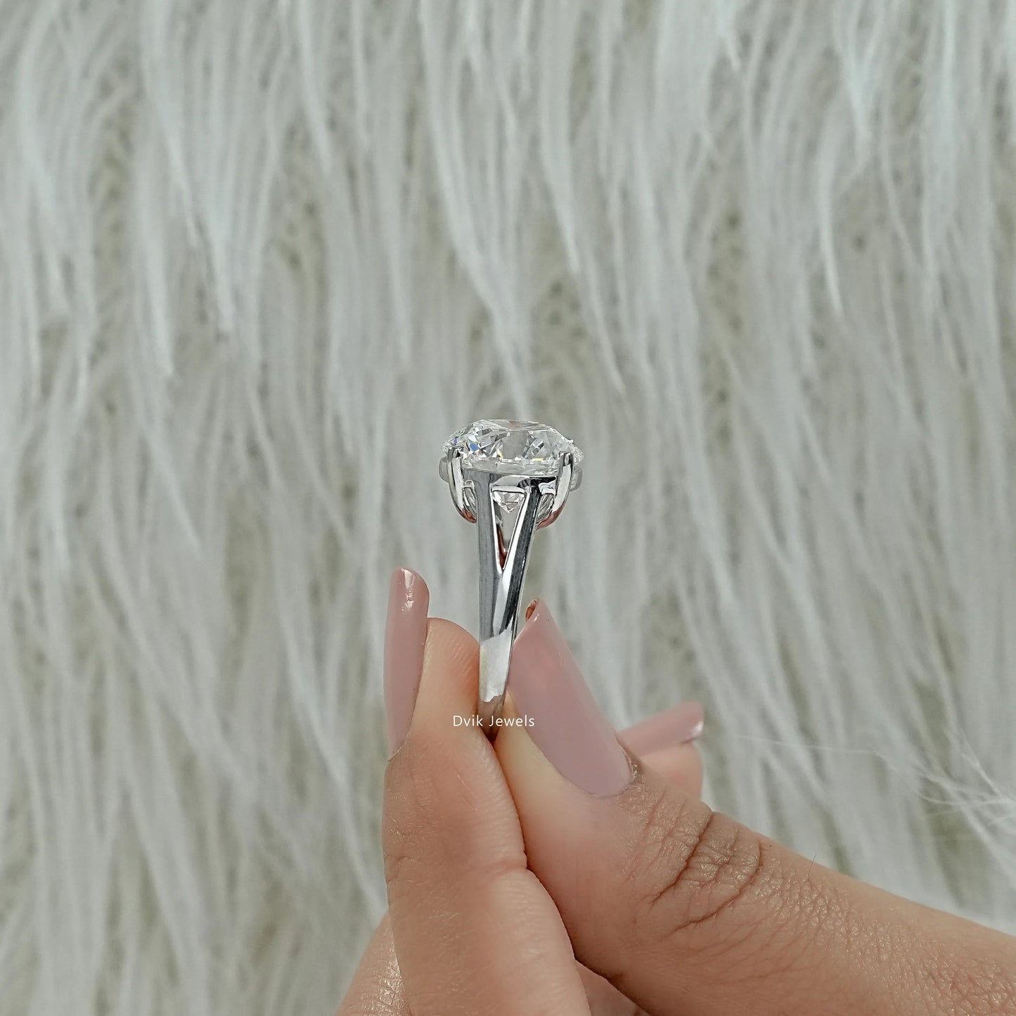 Round diamond engagement ring tapered shank engagement ring close up view