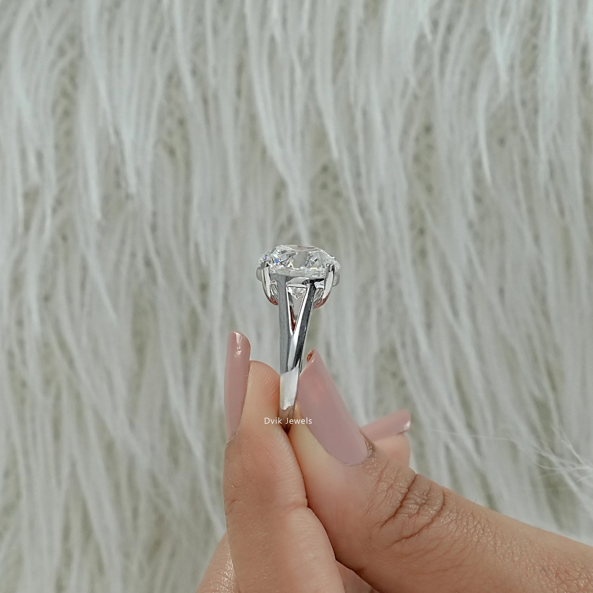 Round diamond engagement ring tapered shank engagement ring close up view