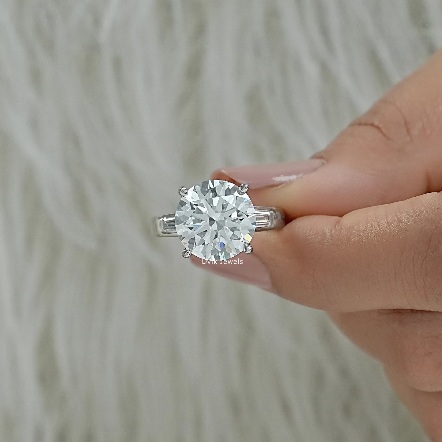 Round and baguette engagement ring round lab diamond engagement ring Finger view