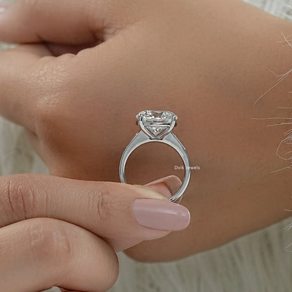 Round diamond with baguettes engagement rings baguette side stone ring profile view