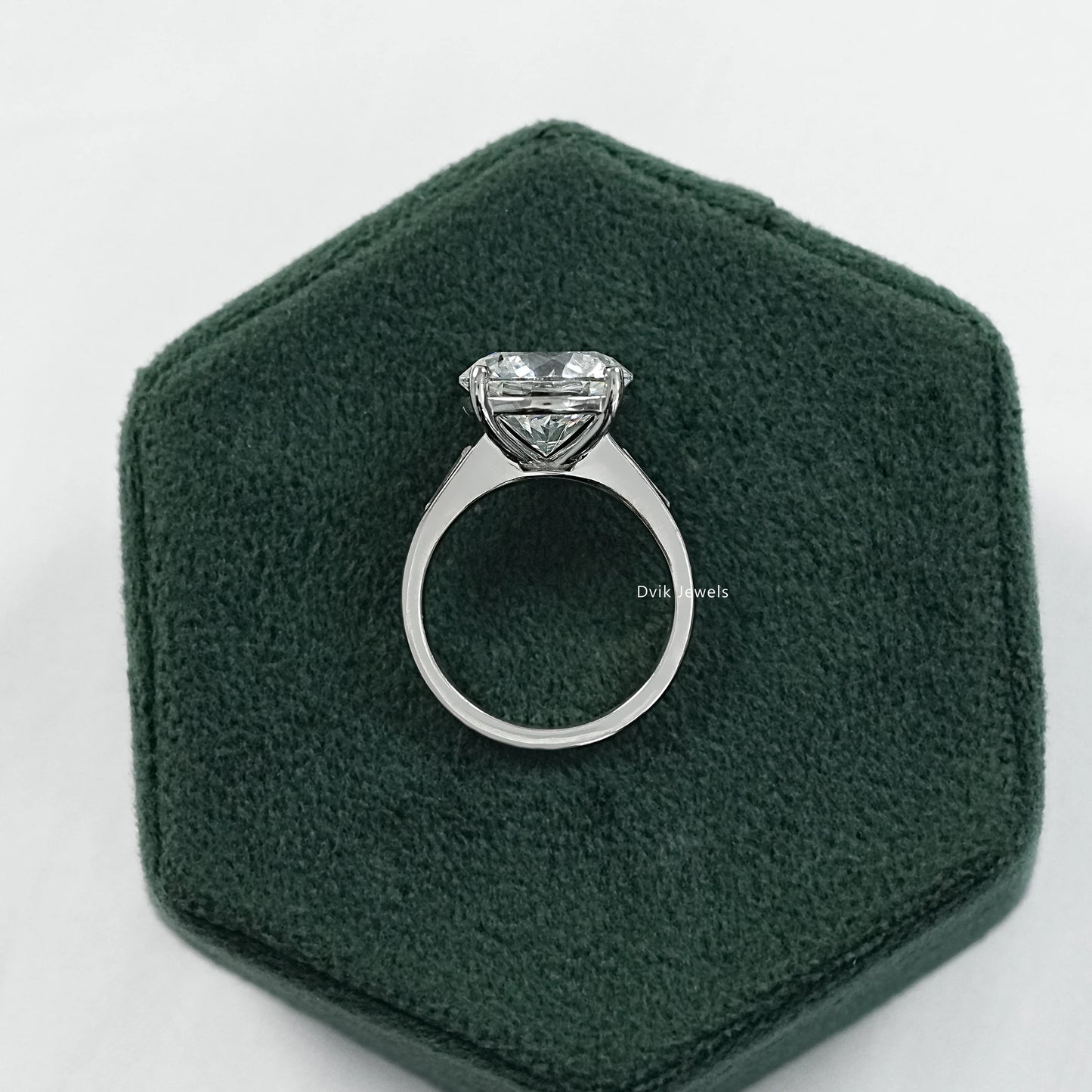 Engagement ring round with baguettes round three stone engagement ring side view