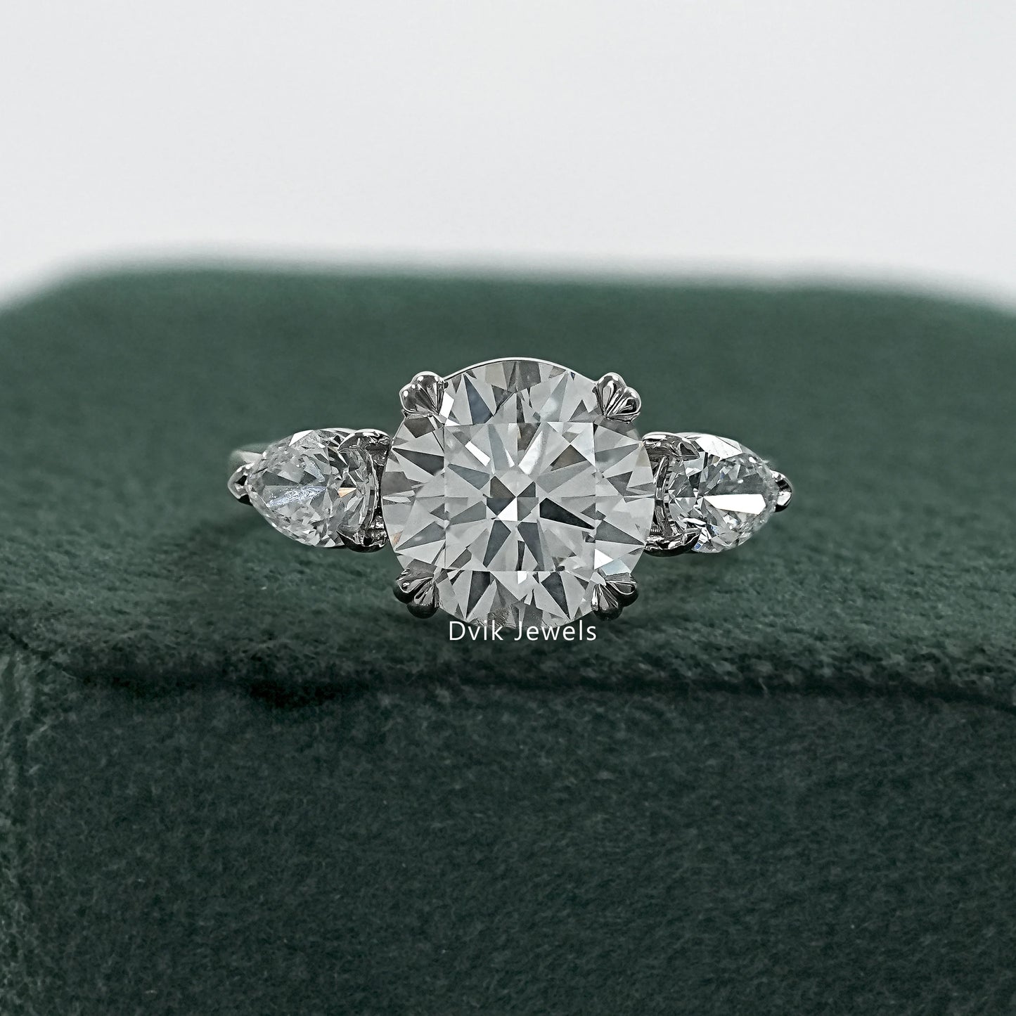 Round and pear diamond ring double prong engagement rings front view