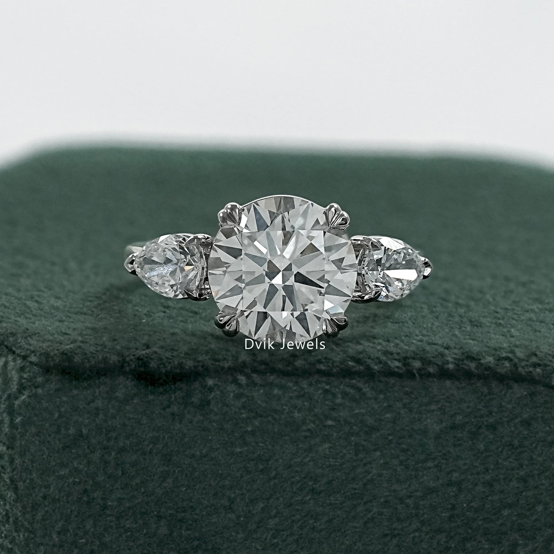 Round and pear diamond ring double prong engagement rings front view