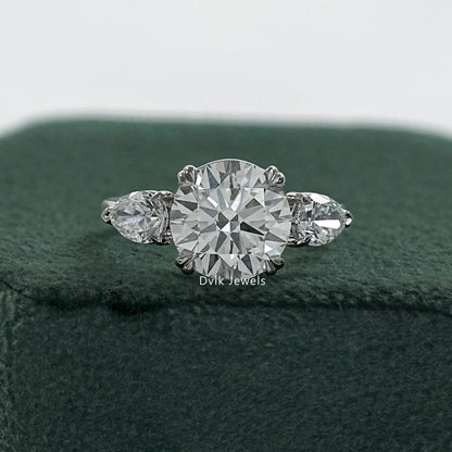 Round and pear diamond ring double prong engagement rings front view