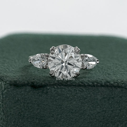 Round and pear diamond ring double prong engagement rings front view