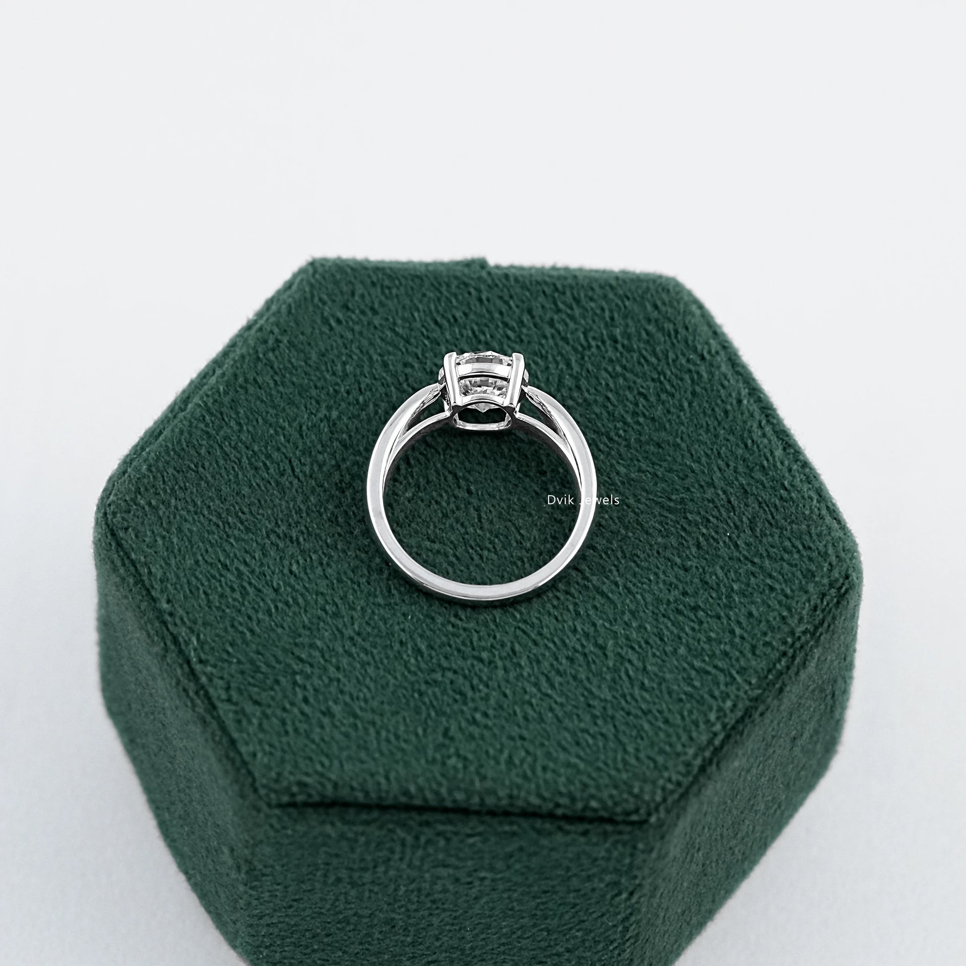 Round Brilliant Cut Solitaire Ring with Lab Diamond placed on box showing back structure