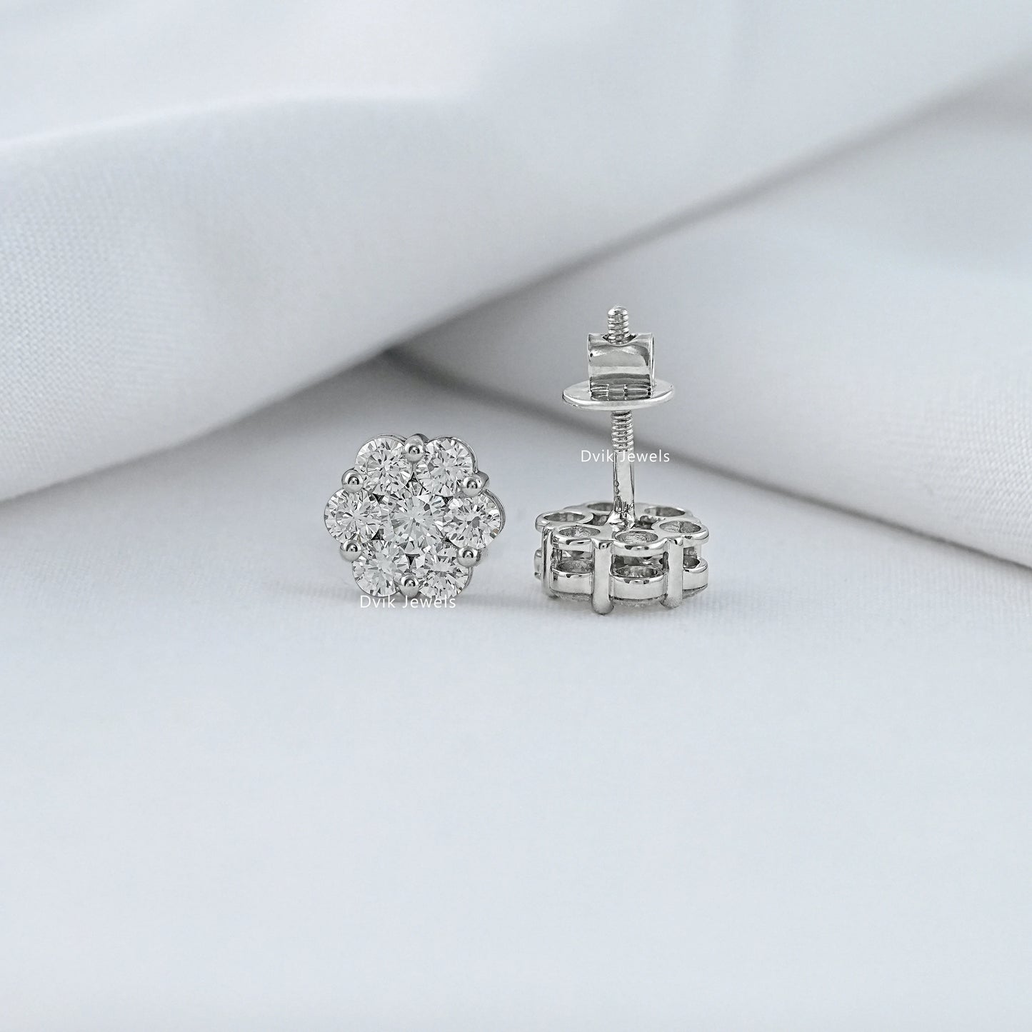 Floral diamond stud earrings showing front and back view