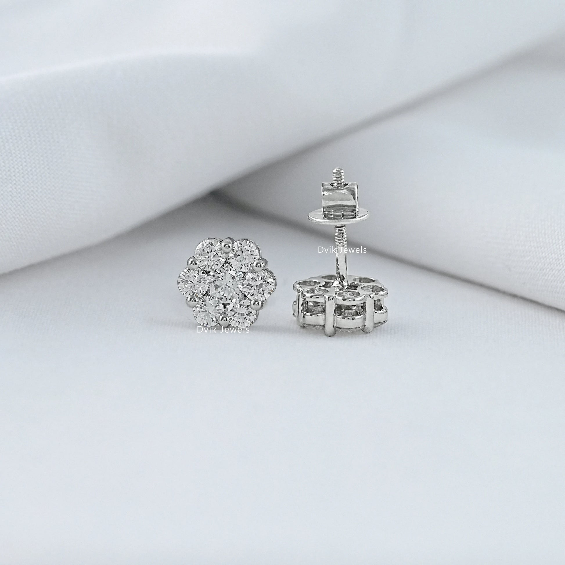 Floral diamond stud earrings showing front and back view