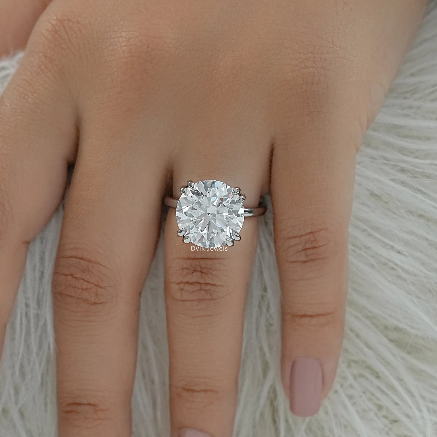 6 prong solitaire engagement rings on finger top view