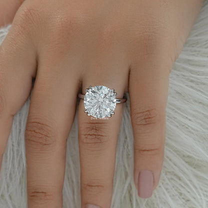 6 prong solitaire engagement rings on finger top view