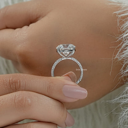 Micro pave engagement ring round stone with side stones profile view