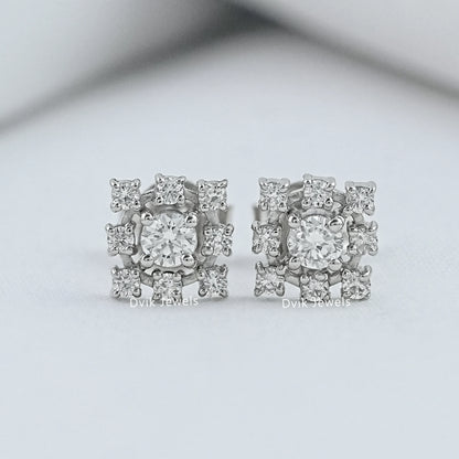 Angled view of halo studs earring on white fabric for our USA bridal jewelry market.