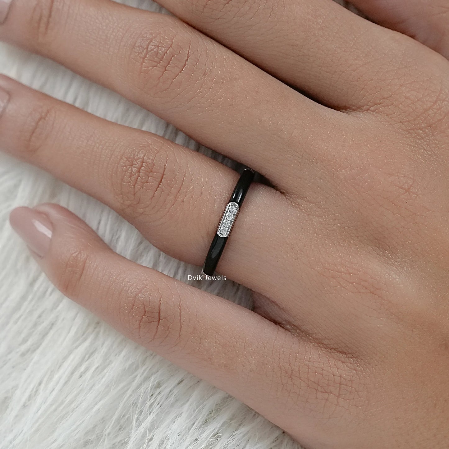 Round cut enamel wedding band black and white gold on finger view