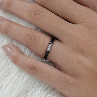 Round cut enamel wedding band black and white gold on finger view