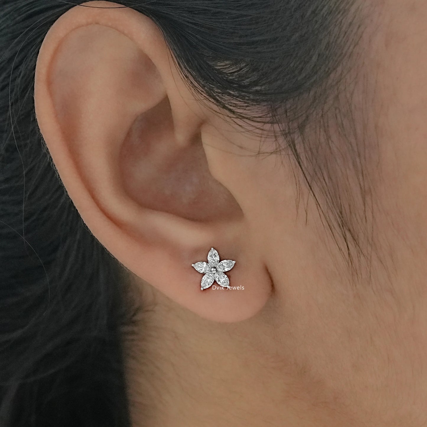 Marquise cut flower earrings worn by women to show scale and fit