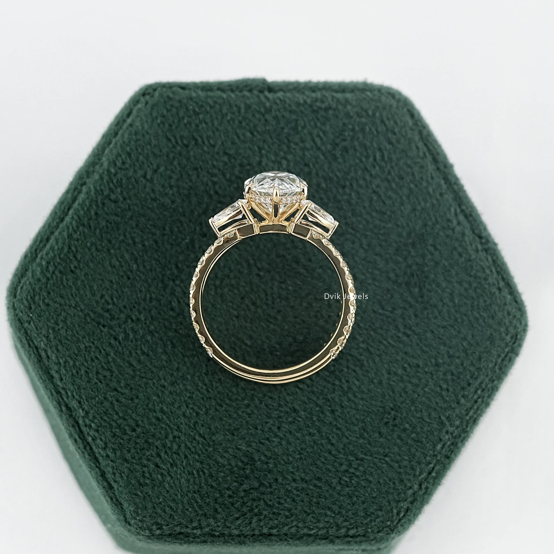 Side profile of marquise diamond two bands bridal set showing how wedding bands sit engagement ring