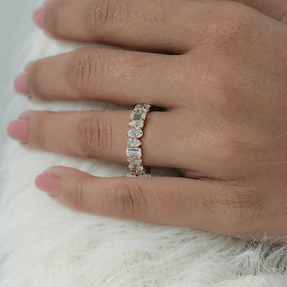 Model wearing lab grown diamond half eternity ring in yellow gold