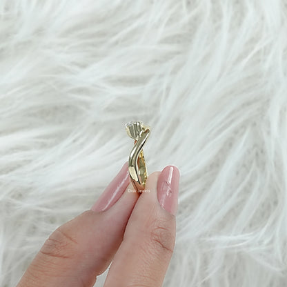 Curved Marquise Cut Solitaire Ring with Lab Created Diamond shown from side view held by woman