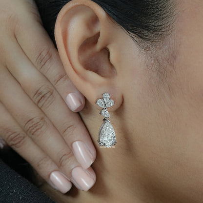 Pear Cut Lab Diamond Floral Drop Earrings worn by woman for modern floral design