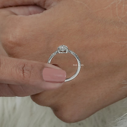 Double pear diamond ring on hand, showing brilliance of mixed-cut diamond shapes