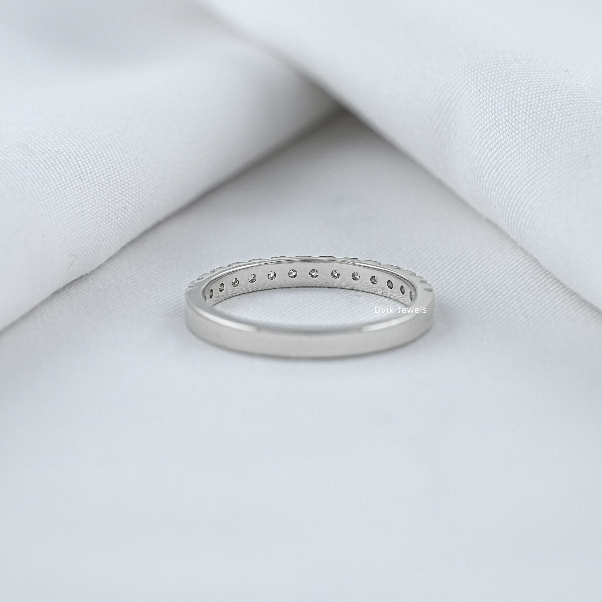 Round diamond half eternity band showing back view