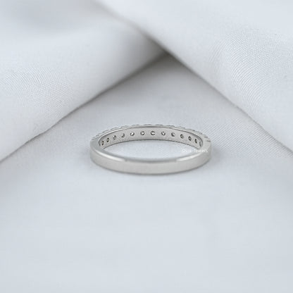 Round diamond half eternity band showing back view