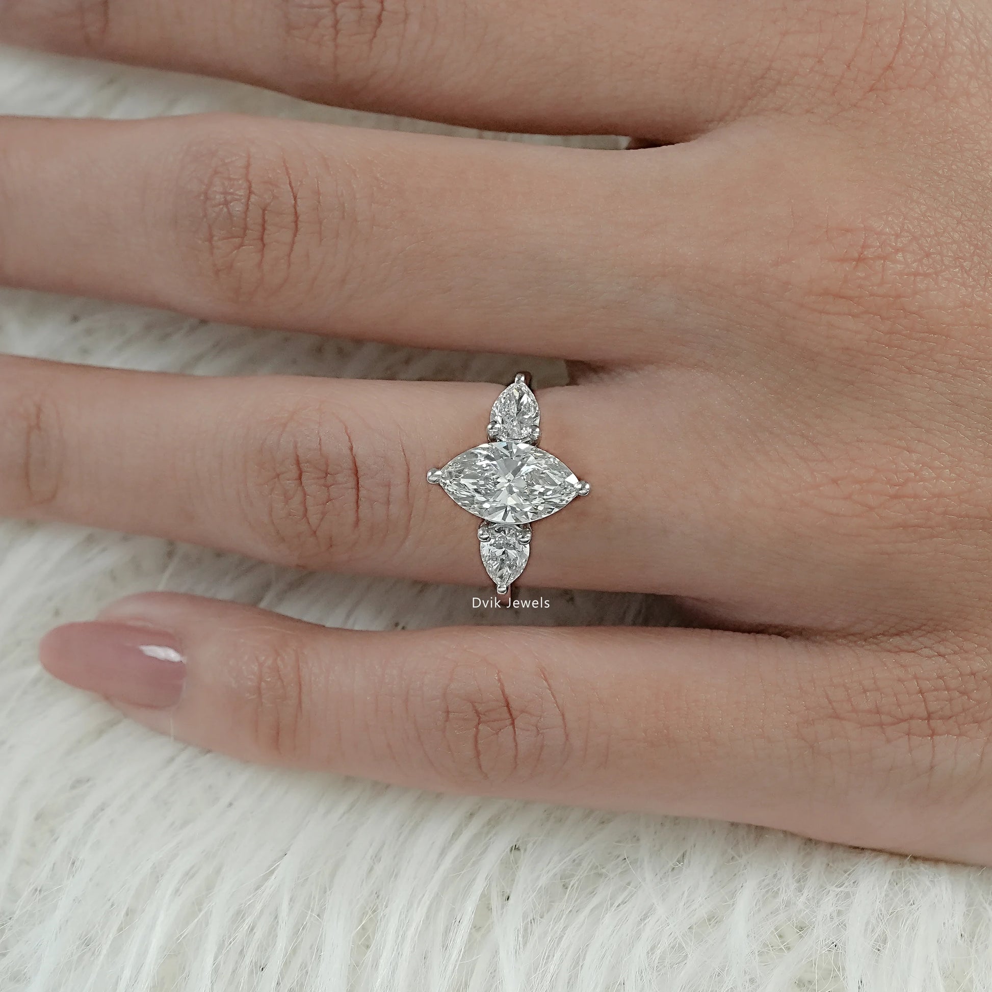 Marquise Cut Lab Grown Diamond Three Stone Ring showcased on model hand