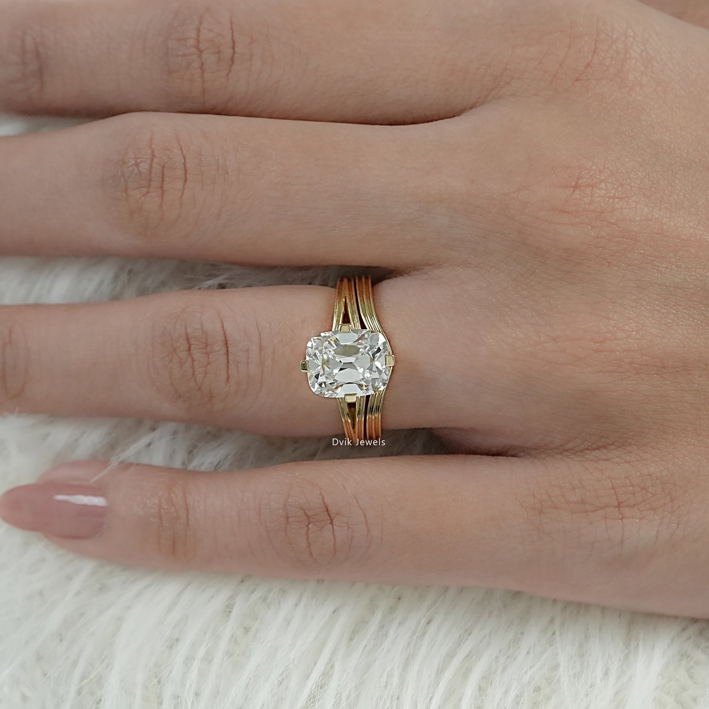 Cushion Cut Lab Diamond Old Mine style Solitaire Ring displayed on woman’s hand