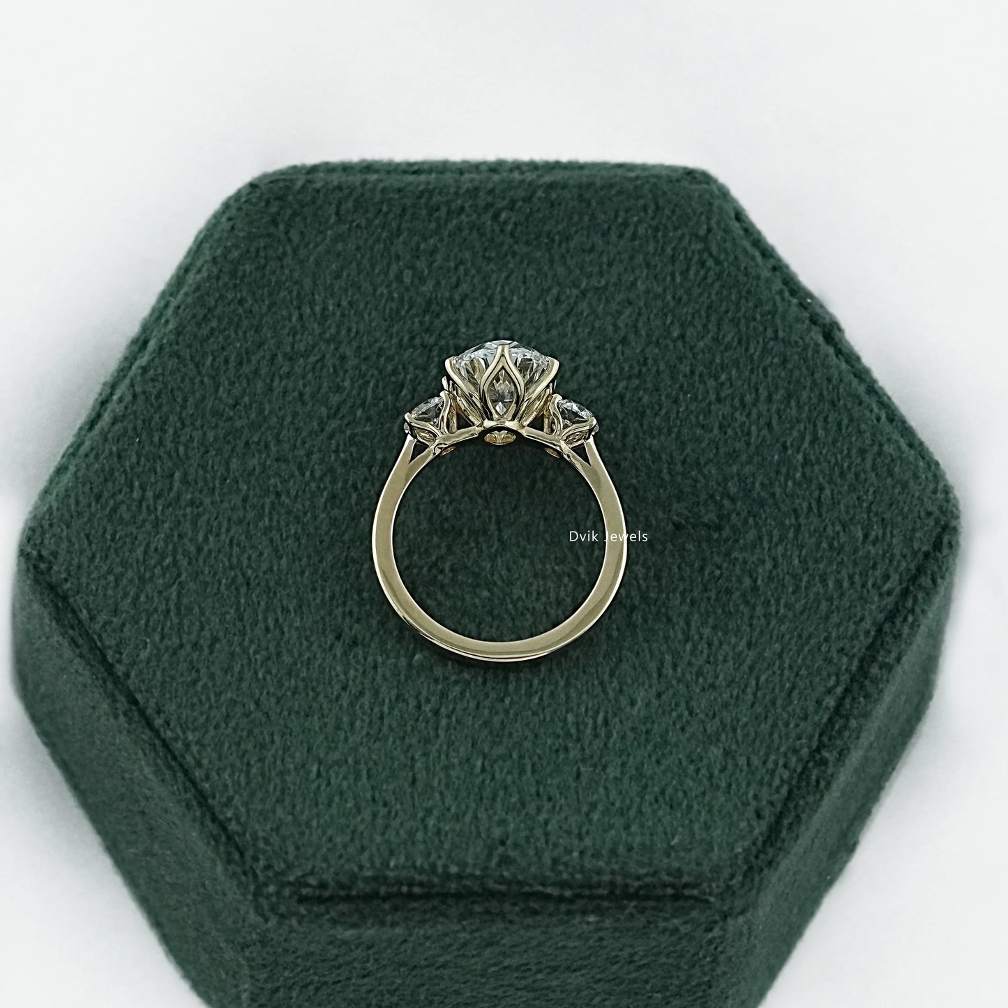 Three stone oval engagement ring white gold with a polished bridal band