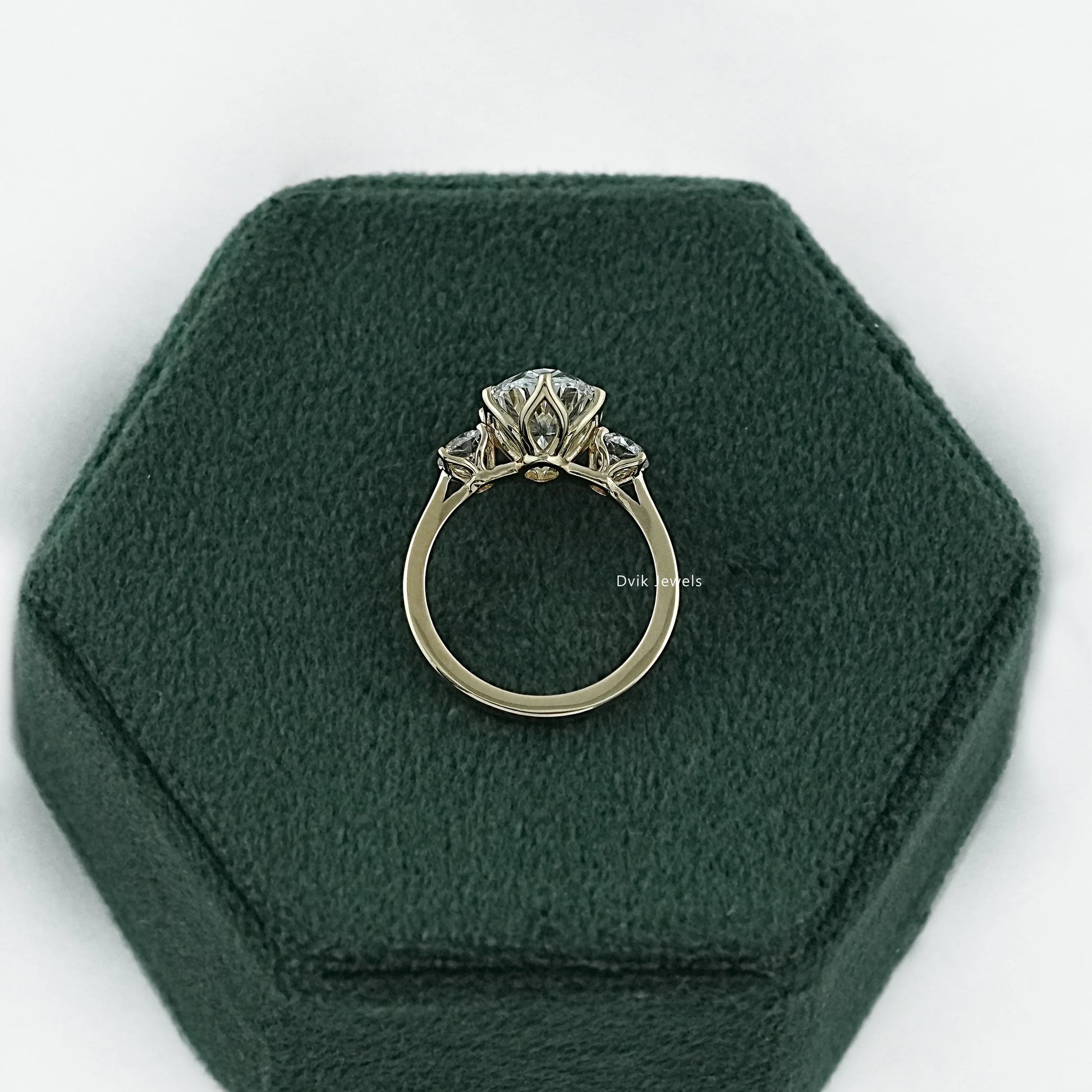 Three stone oval engagement ring white gold with a polished bridal band