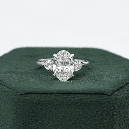 Three-Stone Oval And Round Cut Diamond Ring