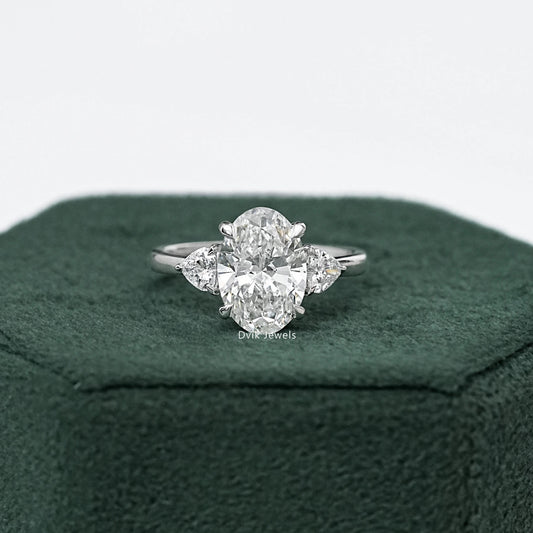 Three-Stone Oval And Round Cut Diamond Ring