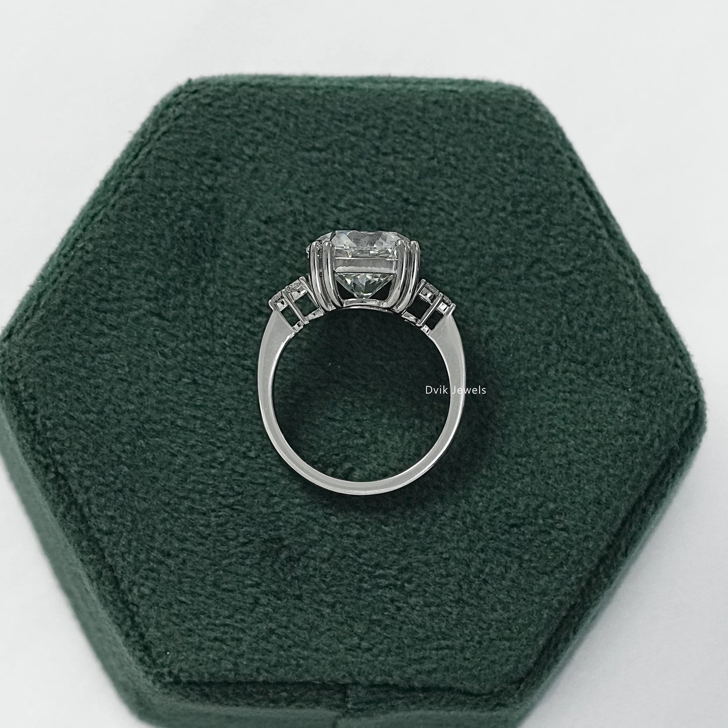 Three stone round ring with 5 carat round diamond engagement ring side view