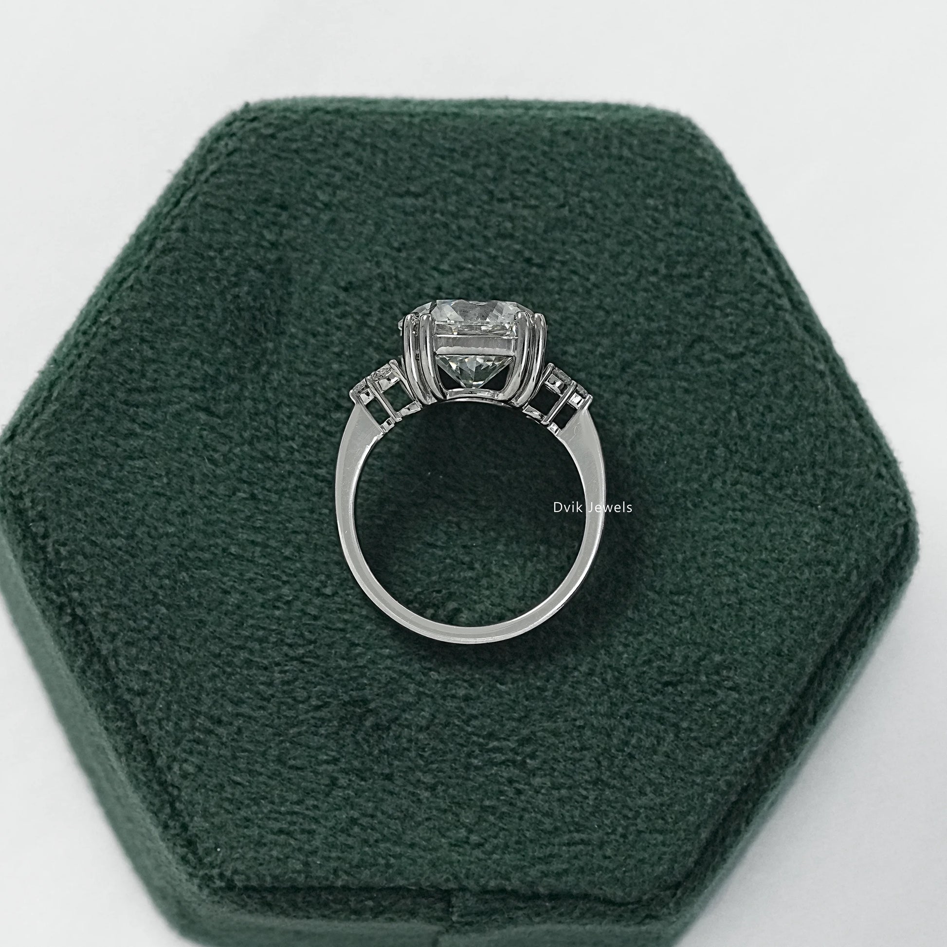 Three stone round ring with 5 carat round diamond engagement ring side view