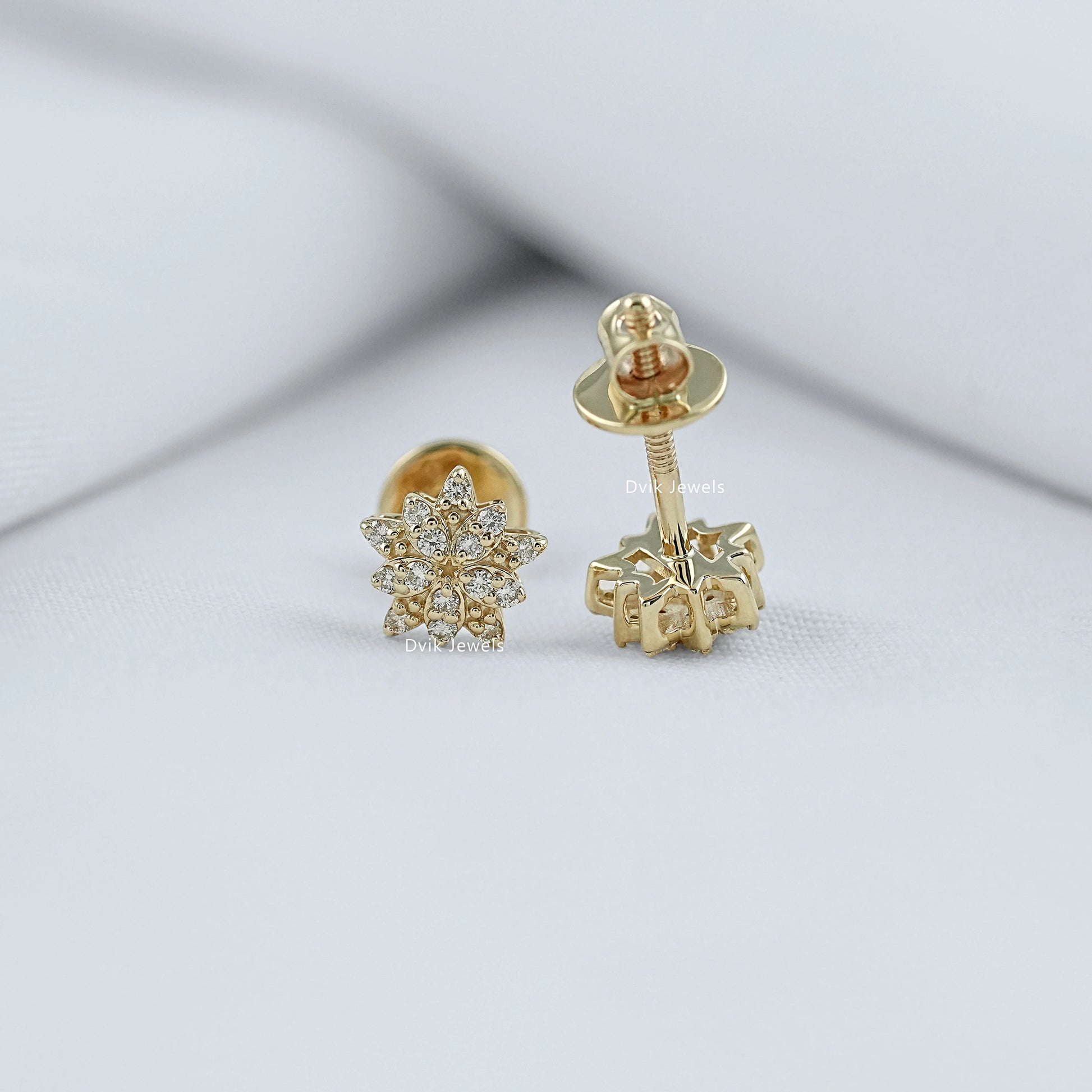 Front and back view of blooming flower stud earrings with round brilliant diamond cut showing secure screw-back post