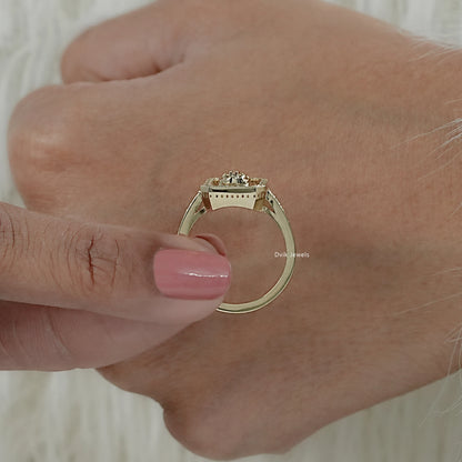 Vertical view of lab grown round diamond ring hold by women to show halo pave detailing