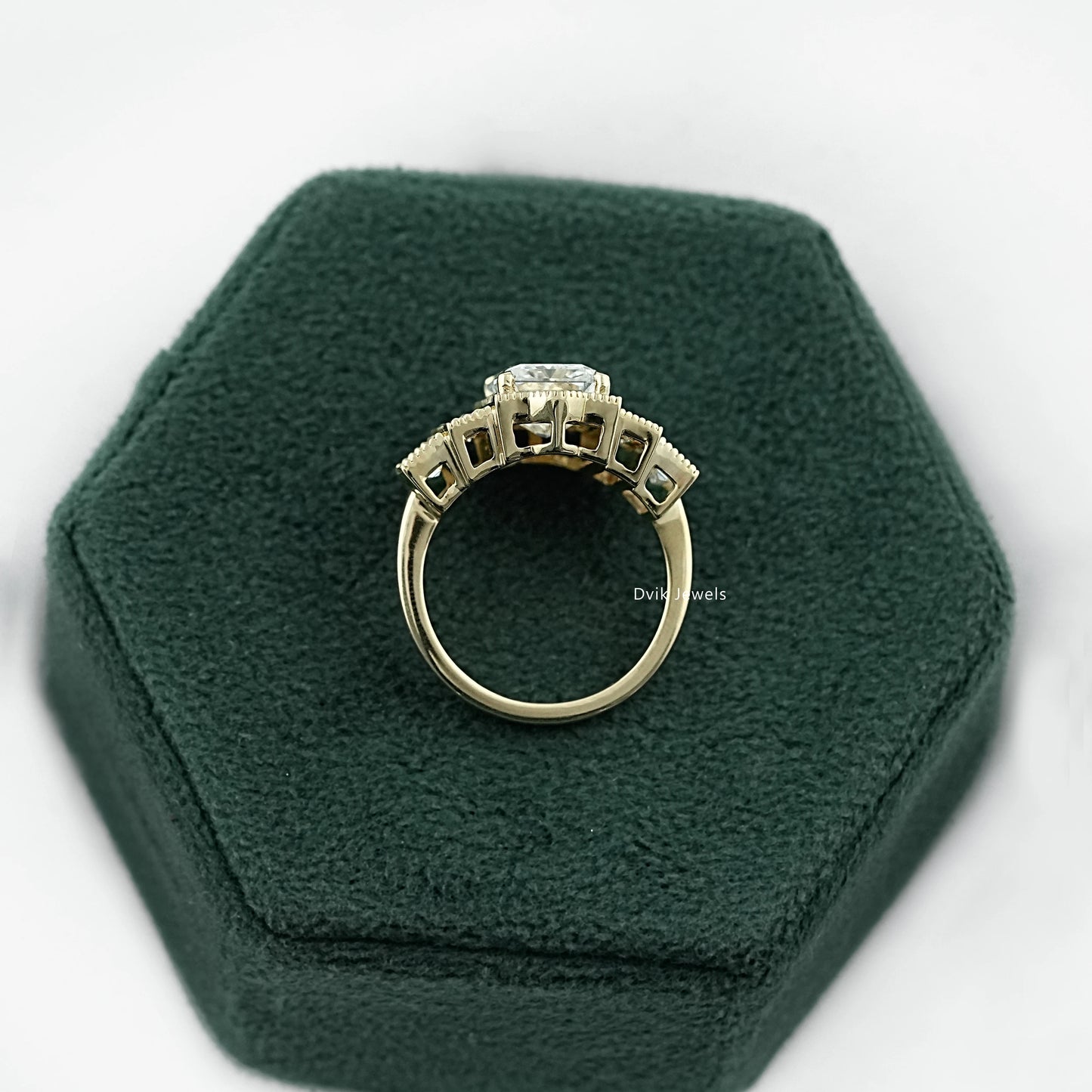 Engagement rings with baguettes and round diamonds in a white gold band.