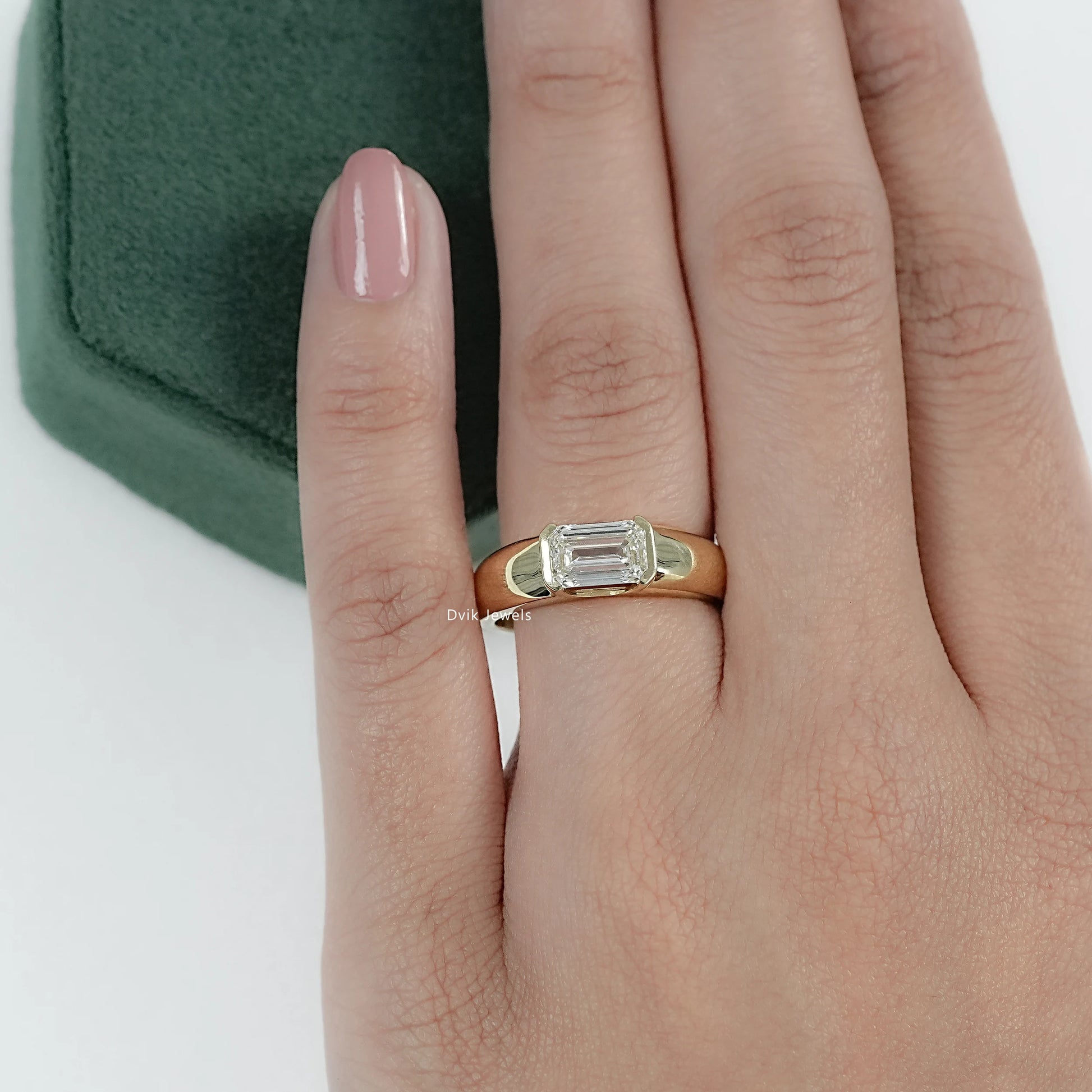 Women hand wearing Emerald Cut Lab Grown Diamond Solitaire Ring with wide band, perfect for daily wear