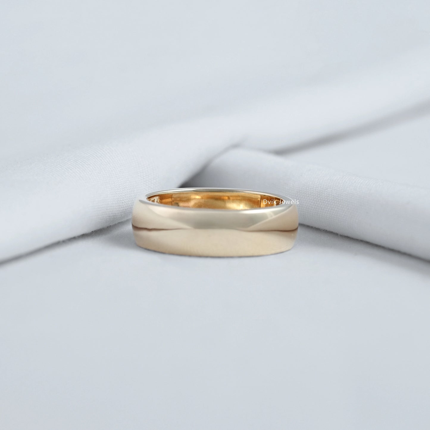 Gypsy diamond ring displayed on a soft fabric for a professional top view