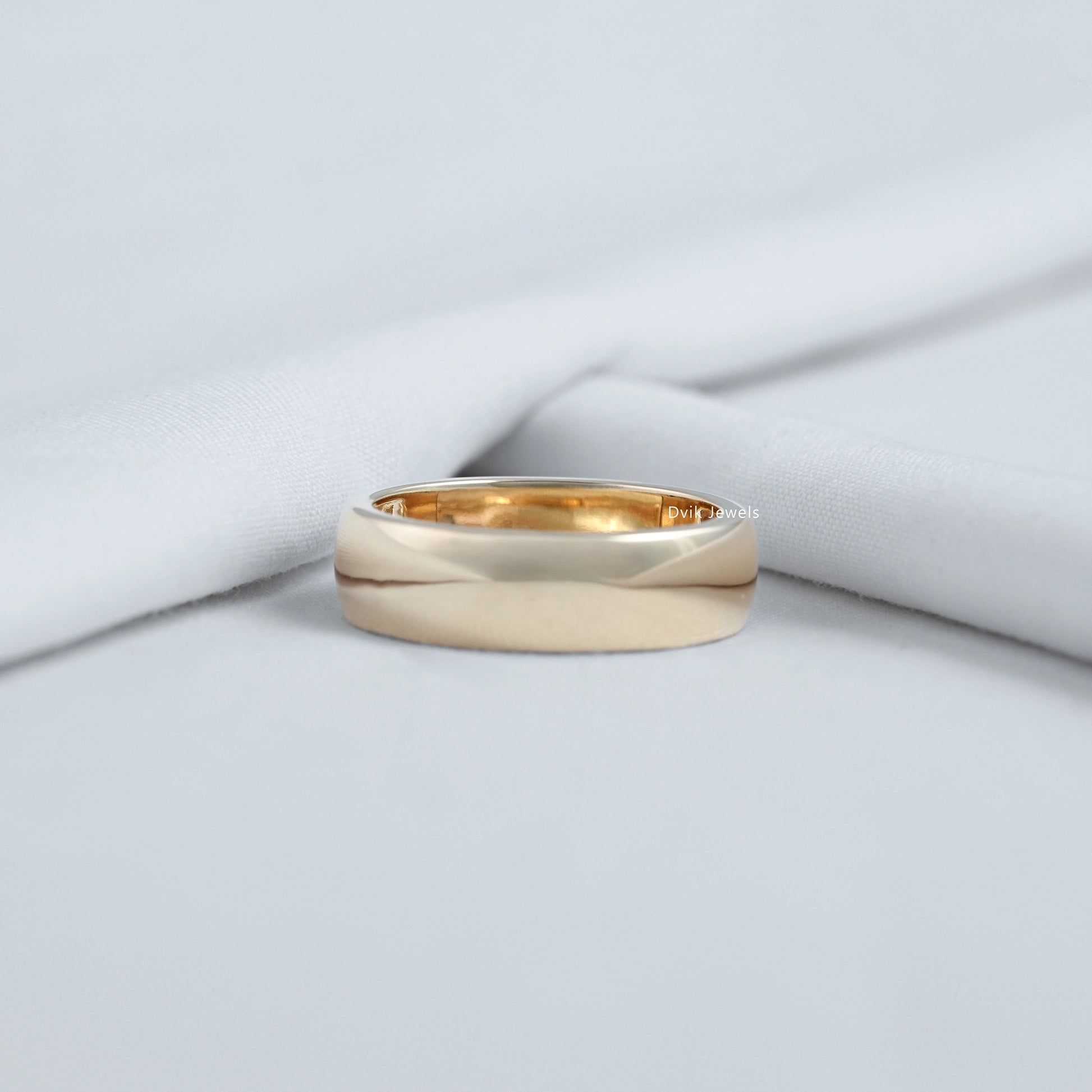 Gypsy diamond ring displayed on a soft fabric for a professional top view