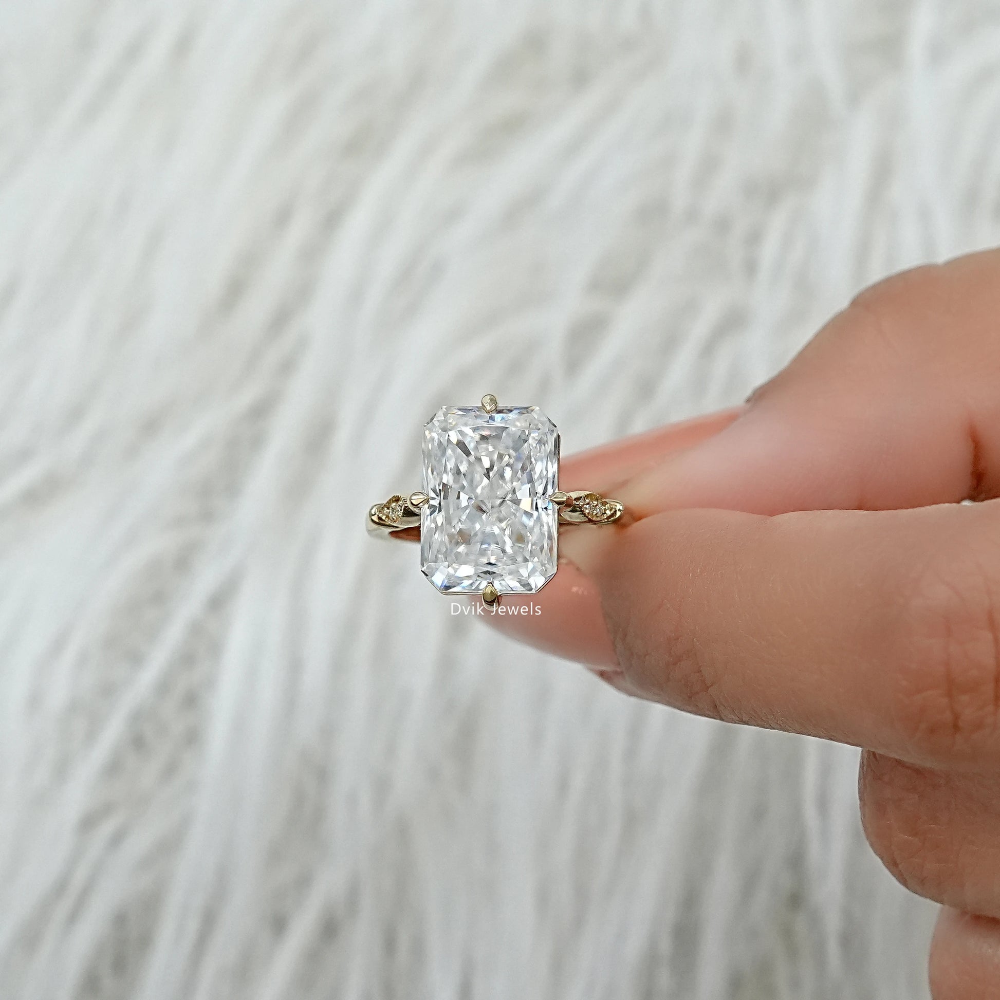 Gold lab grown diamond wedding rings with a crushed ice center stone.