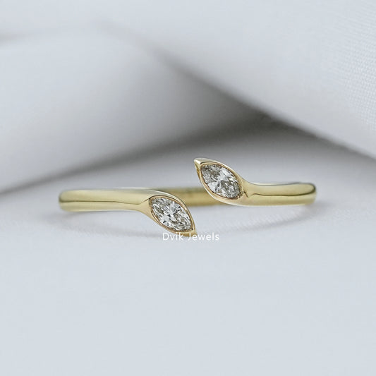 Marquise Bypass Ring by Dvik Jewels in a green velvet box angle view