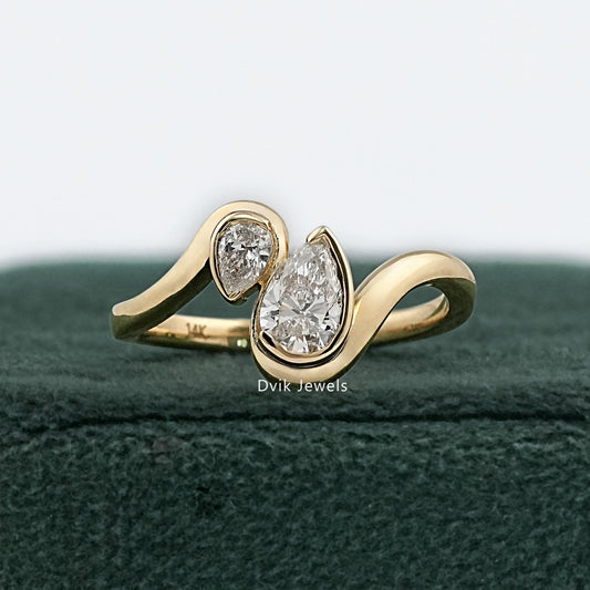 bezel pear engagement ring by Dvik Jewels in vintage green box front view